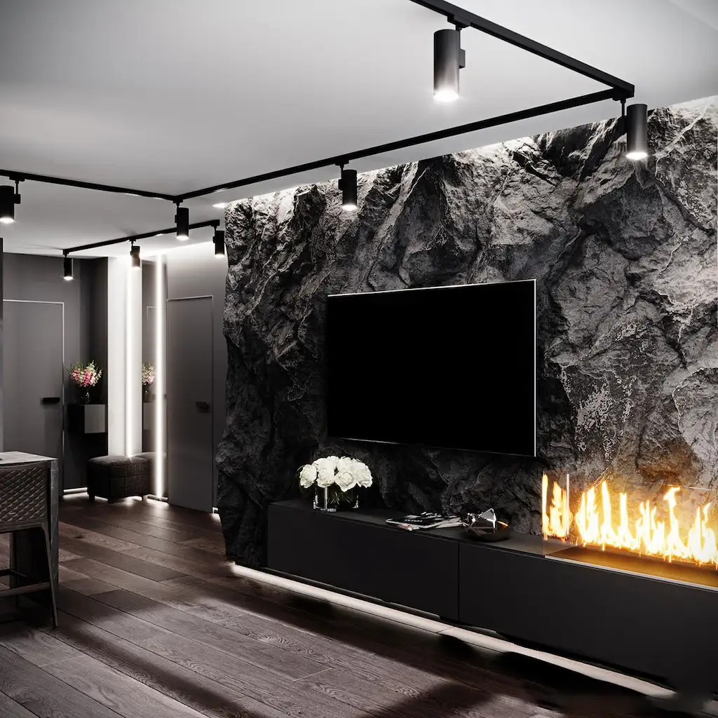 Mur en béton sculpté façon roche noire avec télévision intégrée, console élégante et cheminée linéaire – Réalisation Art Déco Béton